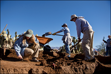image of students digging